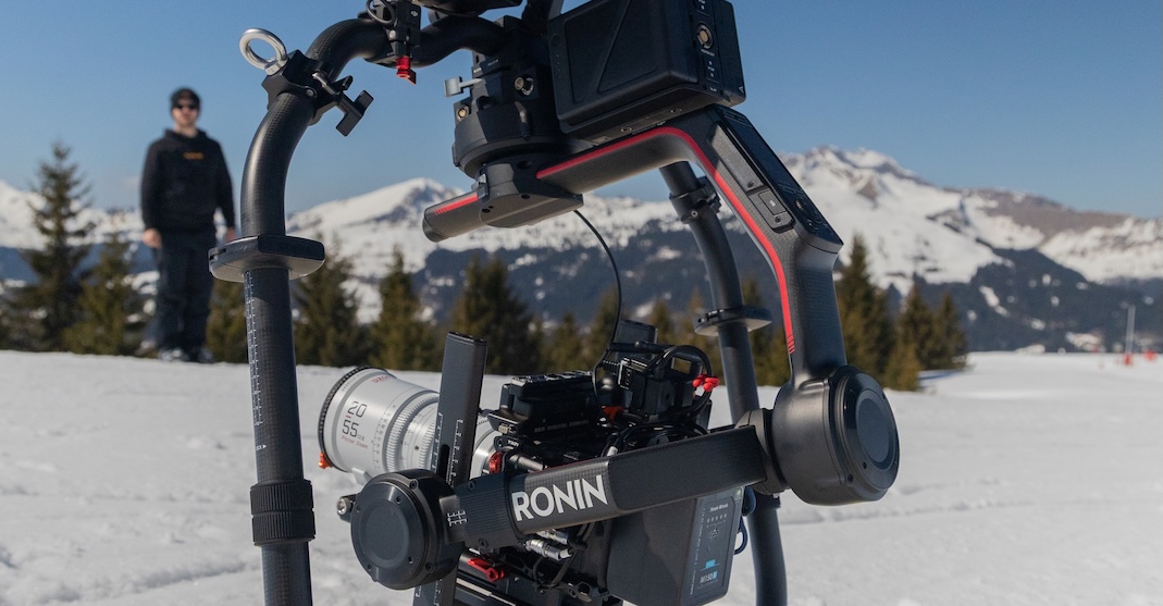 A person filming on a golf cart with camera equipment